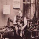 A cobbler mending shoes